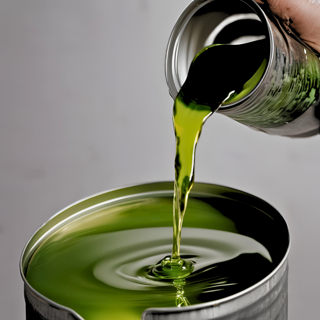 Dark rubber process oil in industrial container, used for tire and rubber manufacturing