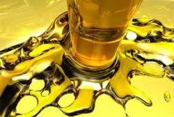 Amber medium viscosity base oil SN350 in industrial storage tank